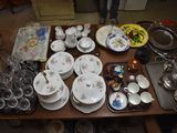 a table with a lot of dishes and cups on it
