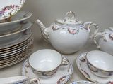 a lot of plates and cups on the table
