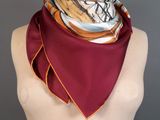 a close up of a mannequin torso with a scarf on it