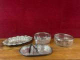 three dishes on a wooden table with a red wall in the background