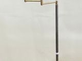 floor lamp with a blue shade on a metal base and a silver base