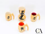 plusieurs modèles différents de tasses à café et de tasses ornées d'un chat