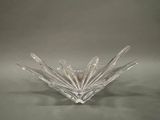 an image of a clear glass bowl on a gray background