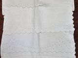 a close up of a white handkerchief on a table