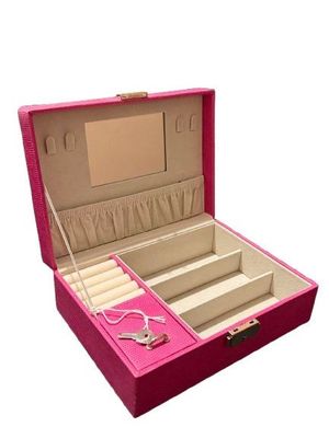a pink box with a jewelry set inside of it