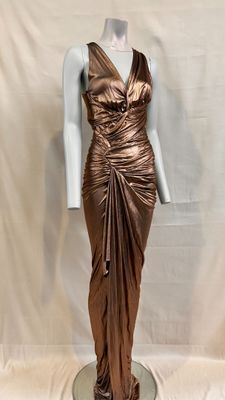 an image of a bronze dress on a mannequin base