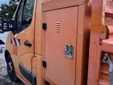 a truck that is parked in the snow with its door open