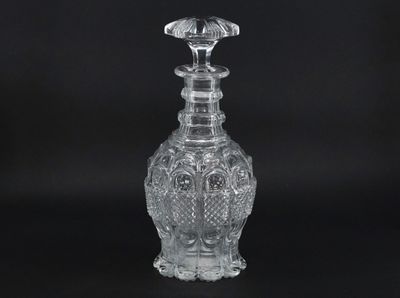 an image of a clear glass bottle on a black background