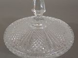 a clear glass bowl with a lid on a table