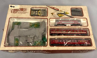 a box with a train set in it on a table