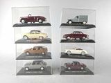 six different models of cars on display in a display case