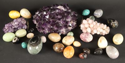 a group of different types of stones on a black surface