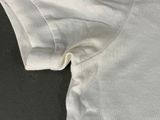 the back of a white t - shirt with a black logo on it