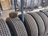 several tires are stacked on a rack in a warehouse