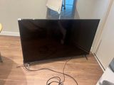 an image of a flat screen tv sitting on a hard wood floor