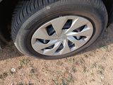a close up of a car ' s tire on the ground