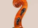 an antique violin with the back of the bow facing upward