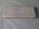 a silver box that is sitting on a table