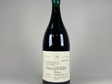 a close up of a bottle of wine on a table