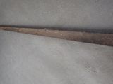 an old pair of scissors sitting on top of a piece of cloth