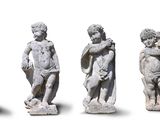 four statues of a boy and a girl on a white background