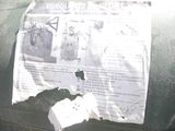 a piece of paper taped to the back of a car