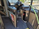 a view of the inside of a bus from the driver ' s seat