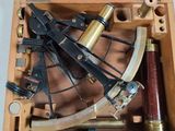 a wooden box with a brass sexet inside of it