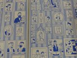 a blue and white book with pictures of people on it