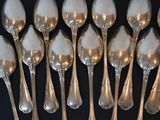 a lot of spoons that are sitting on a table