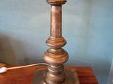 a lamp that is sitting on a wooden table