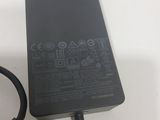 a close up of a laptop charger sitting on a table