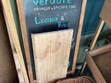 a sign that says verdure on the side of a building