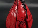 a close up of a red boxing bag with writing on it