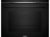 a black oven with the door open on a white background
