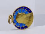 an image of a close up of a gold and blue broochle