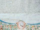 a very old book with a clock on it