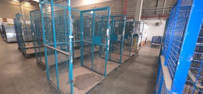 many cages that are in a large room