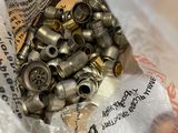 a bag full of metal fittings sitting on a table