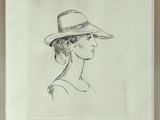 drawing of a woman wearing a hat in a frame on a wall