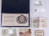 several different types of currency are laid out on a white surface