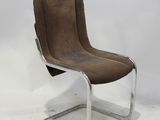 an image of a brown leather chair on a metal frame