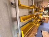a yellow shelf in the back of a bus