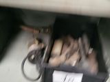 a drawer full of assorted items in a room