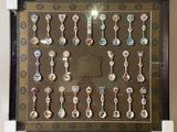 a picture of a display case with a lot of spoons on it