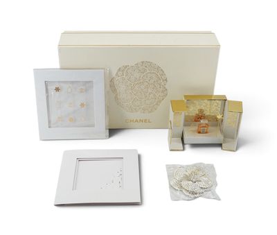 a white box with a picture frame, a picture frame, and other items