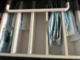 a drawer that has a bunch of folded towels in it
