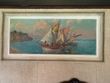 une photo d'un tableau accroché au mur au-dessus d'un lit