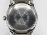 an image of a close up of a wrist watch on a white surface
