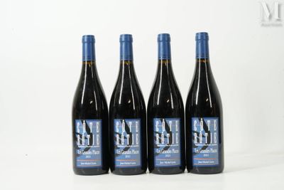 three bottles of wine sitting on top of a white table
